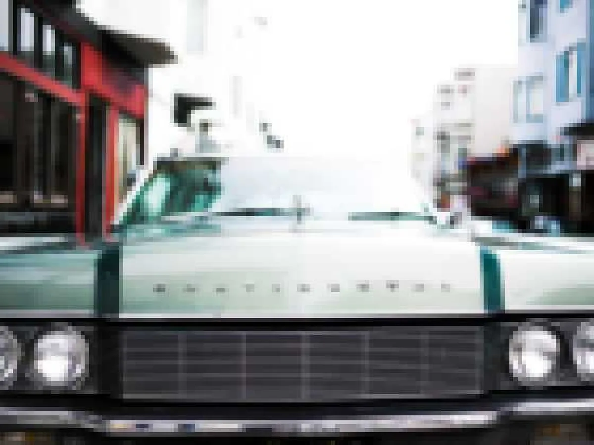 Pixelated photo of a classic car grille, Before