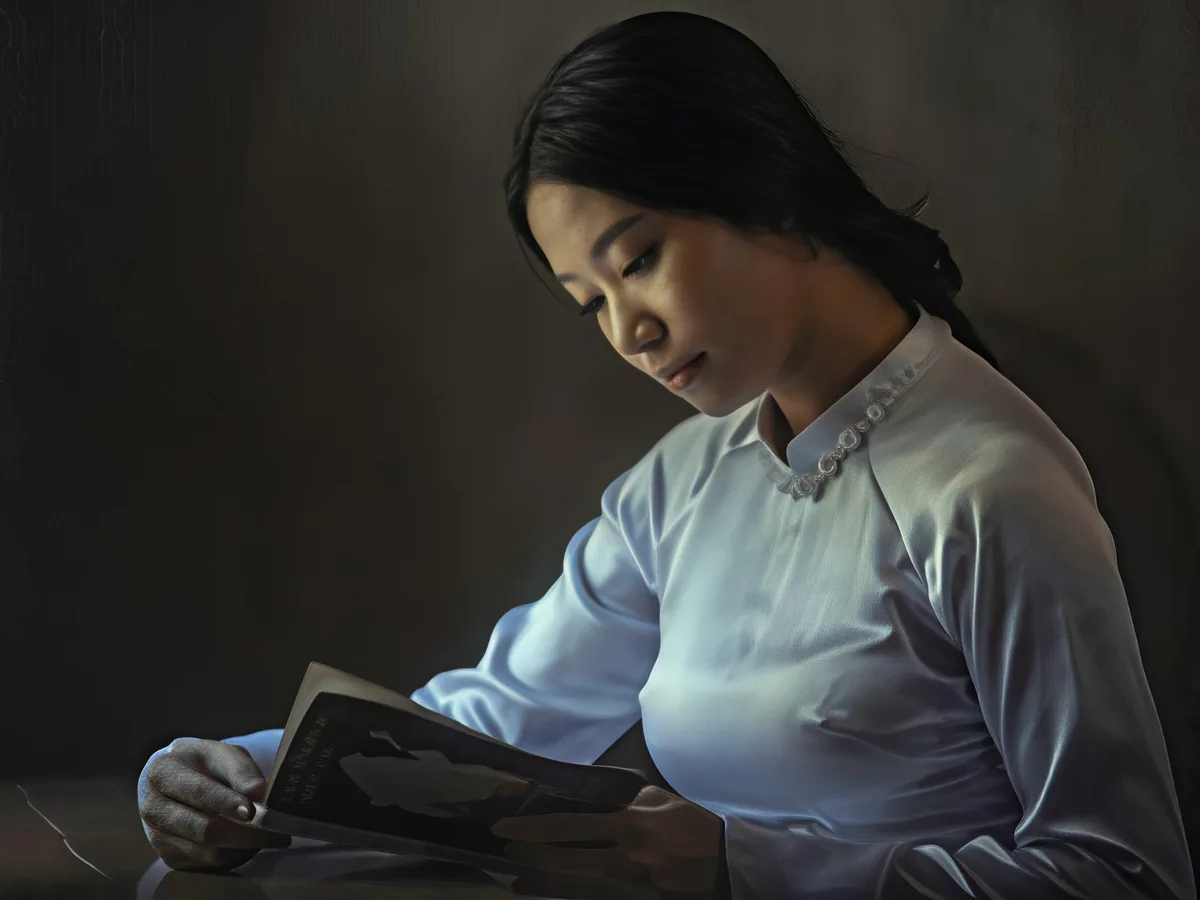 Out-of-focus photo of a woman reading, after enhancement