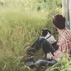 Out-of-focus photo of a man and his dog